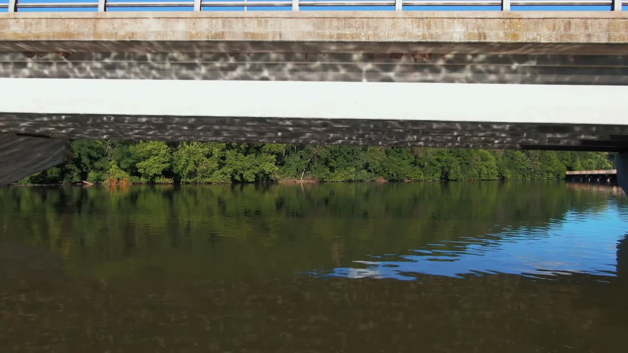 Drone Shot Passing Under Bridge on Fox River in Appleton, Wisconsin
