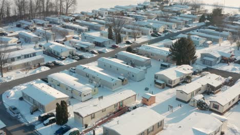 aerial of mobile home trailer park during winter snow