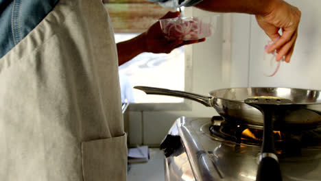 Waiter-working-at-counter-of-food-truck