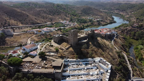 mertola castle on hilltop overlooking guadiana river in beja, portugal