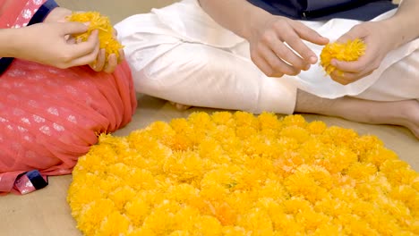 indian couple making rangoli