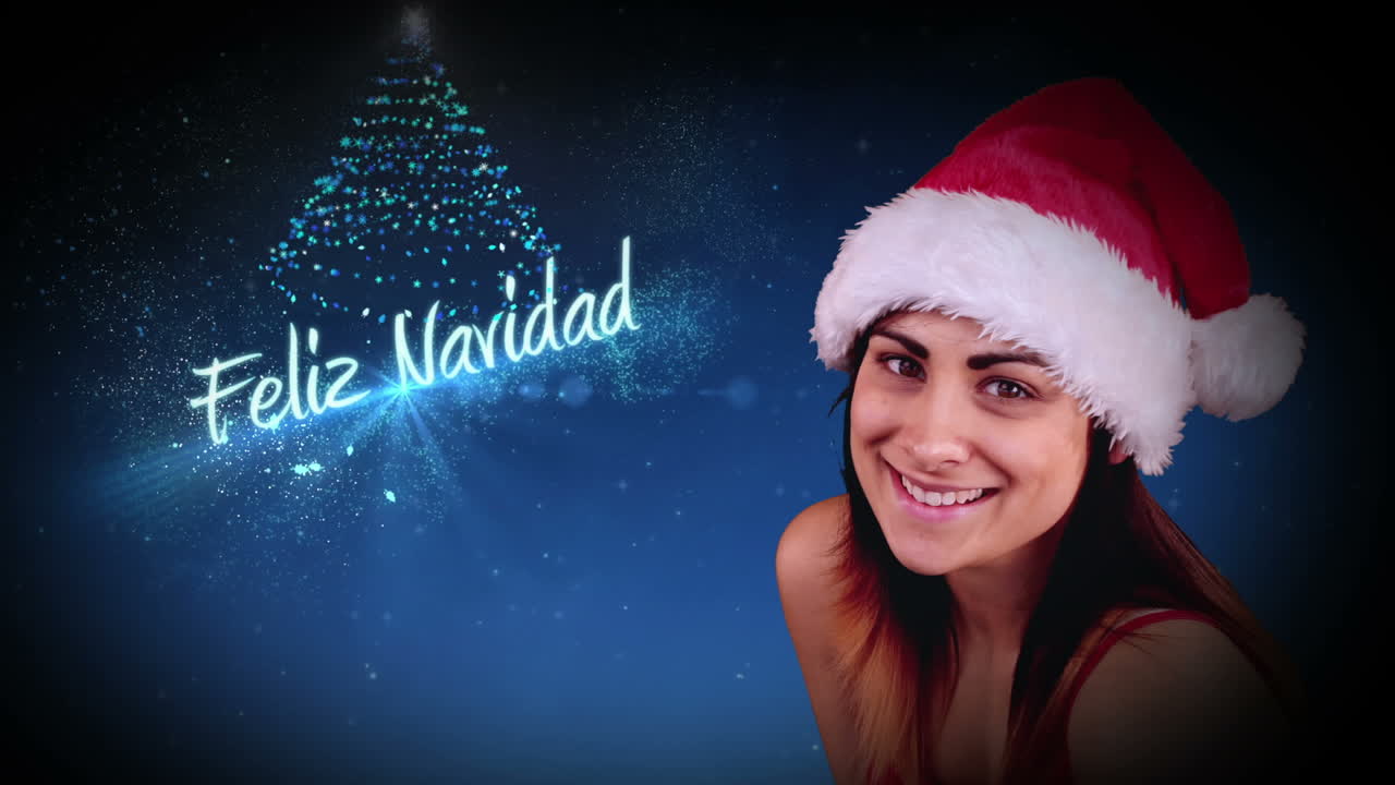 una morena festiva soplando un saludo mágico de navidad