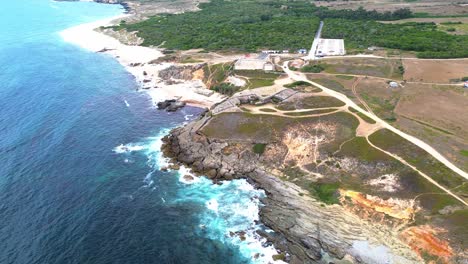 aerial-view-of-rugged-coast-,-blue-waves,-4k