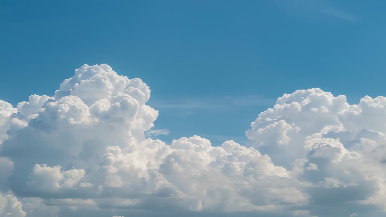 Breezing wind causing cumulus cloud formation expanding and drifting across blue sky, revealing gap