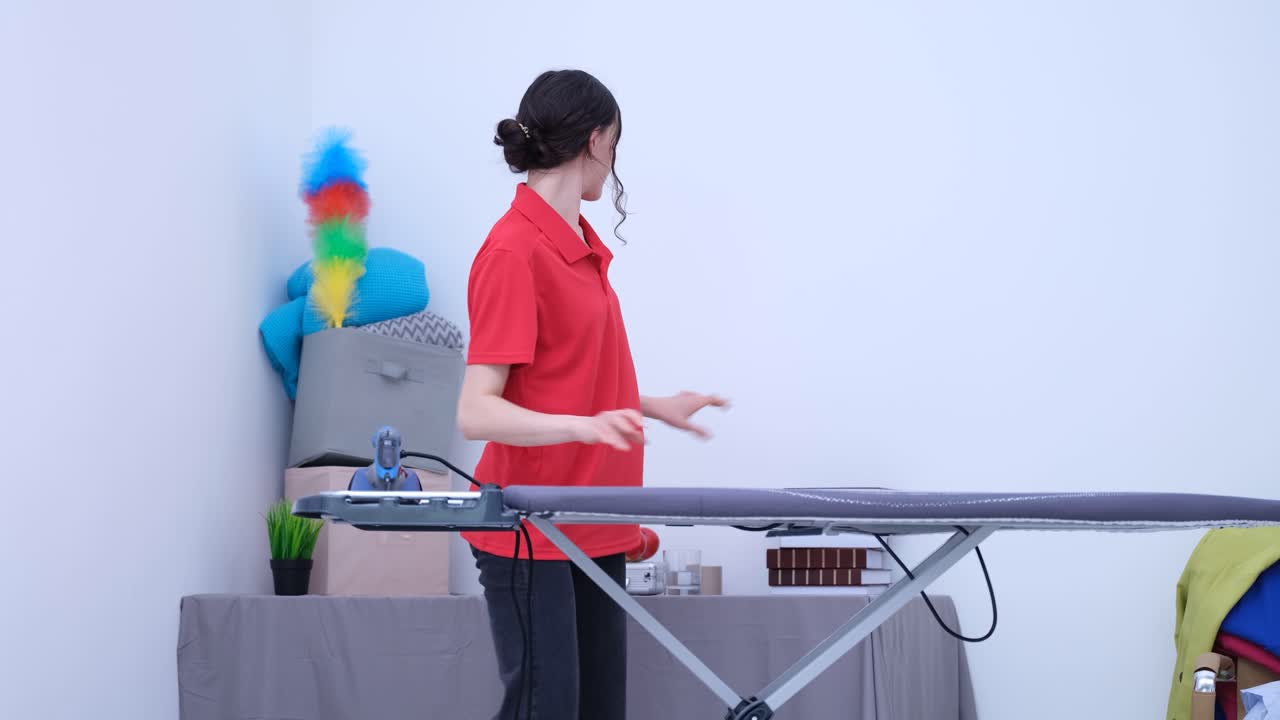 Woman ironing clothes