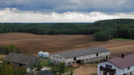 barnhouse and silo in the village of piaszno in pomeranian voivodeship, poland - high angle shot