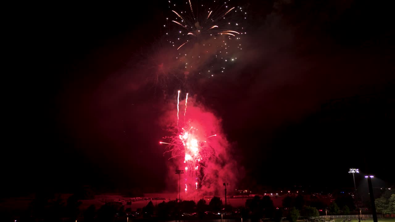 Beautiful Bright Fireworks At Night Sky - Low Angle Shot