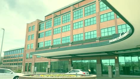 HD-steady-shot-of-main-hospital-entrance-showing-light-traffic