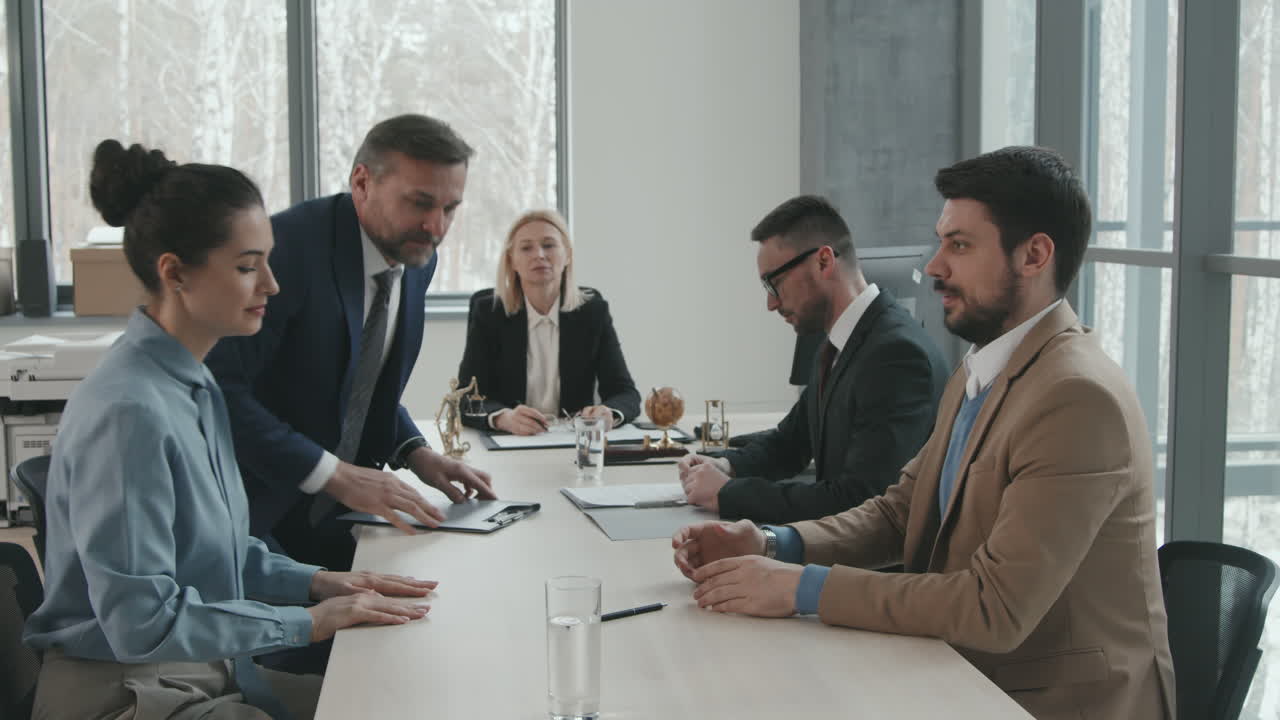 Business Partners Signing Legal Papers