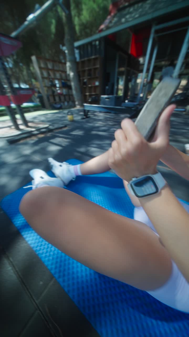 Woman exercising at an outdoor gym