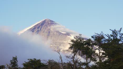 static shot of lanín volcano covered with snow and a blue sky in neuquén, argentina.