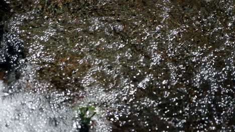 Nice-motion-background-shot-of-water-shot-in-slow-motion-in-mountain-stream..