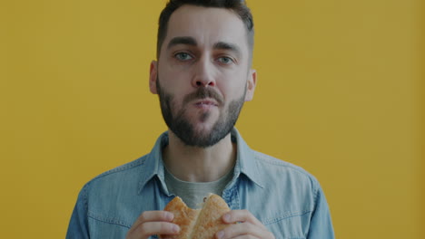 man eating a hamburger