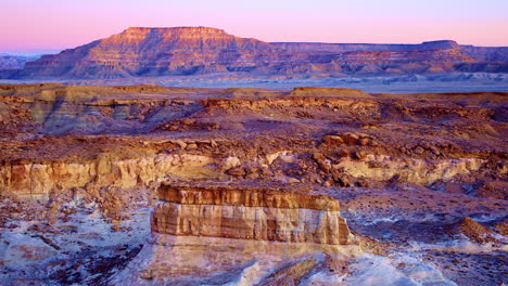a slow, dramatic drone shot captures the vibrant hills, unique rock formations, and hoodoos near the utah-arizona border.