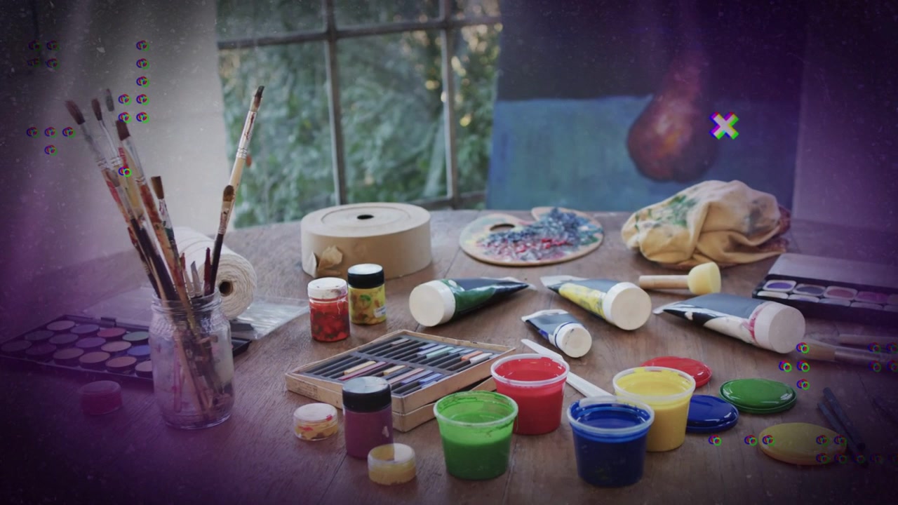 At sequence start tabletop art supplies remaining still while overlays float and spin showing tools
