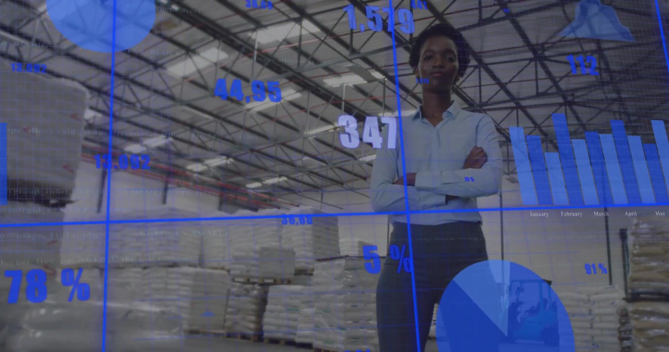 Businesswoman Standing in Warehouse with Digital Data Overlay