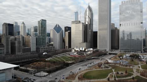 chicago usa, aerial view of millennium park, skyscrapers, towers and traffic on cloudy autumn day