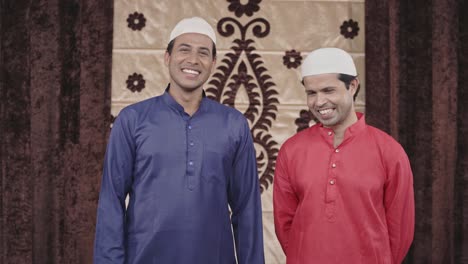 two muslim men laughing and enjoying