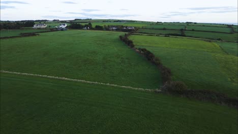 Green-Countryside-Farm-Fields-in-Kenmare,-County-Kerry,-Ireland---Aerial