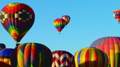 colorful balloons rise above the albuquerque balloon festival