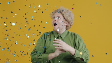man celebrating with confetti
