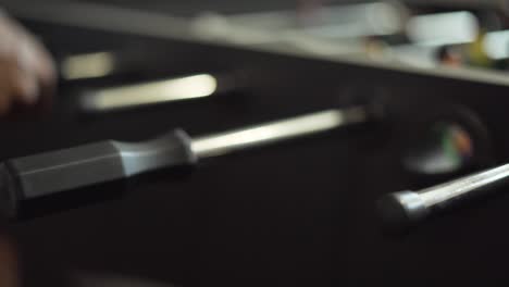 Close-Up Shot of Hands Playing Foosball