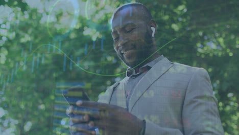 animation of statistical data processing over happy african american man using smartphone on street