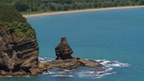 static view of le bonhomme rock on popular la roche percée beach, new caledonia