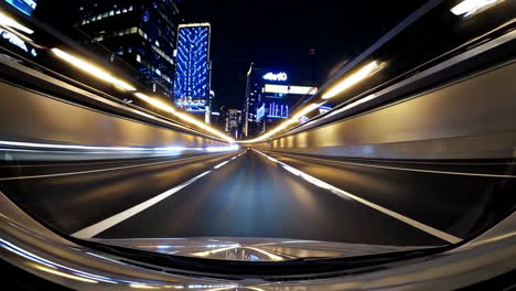 driving through a city tunnel at night