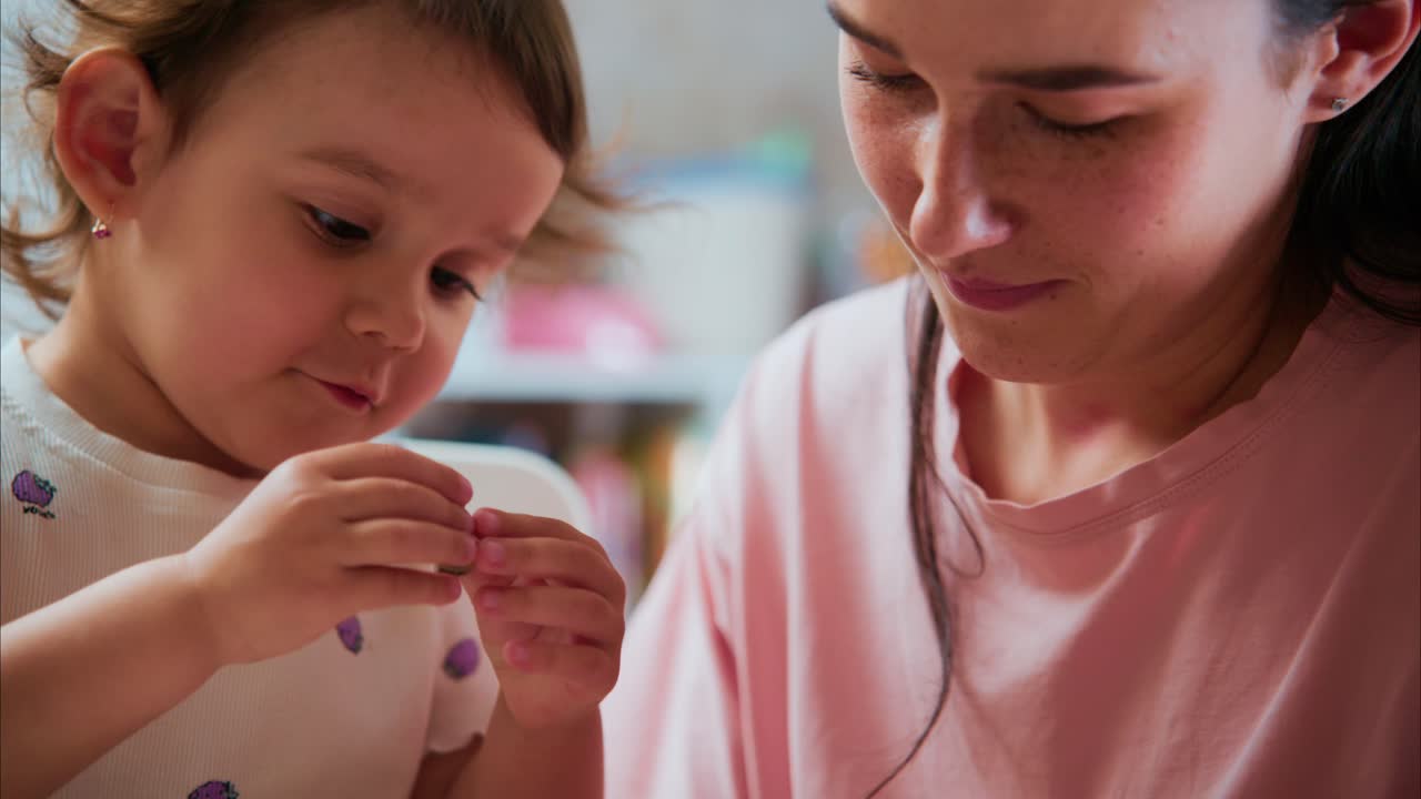 A Heartwarming Moment: A Young Child Engages in Creative Play with a Caring Adult, Fostering Learning and Connection Through Shared Activities