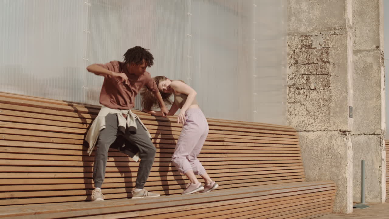 Woman Joining Man Dancing on Bench
