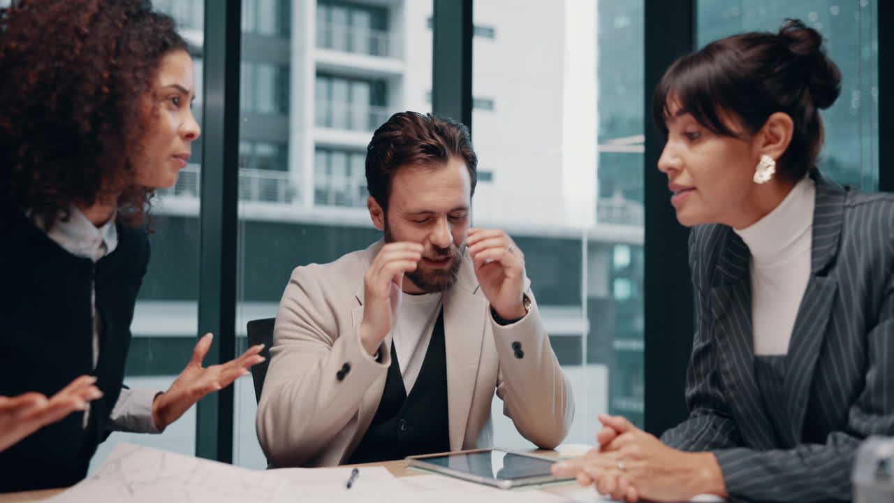 Stressed Businessman During a Tense Meeting