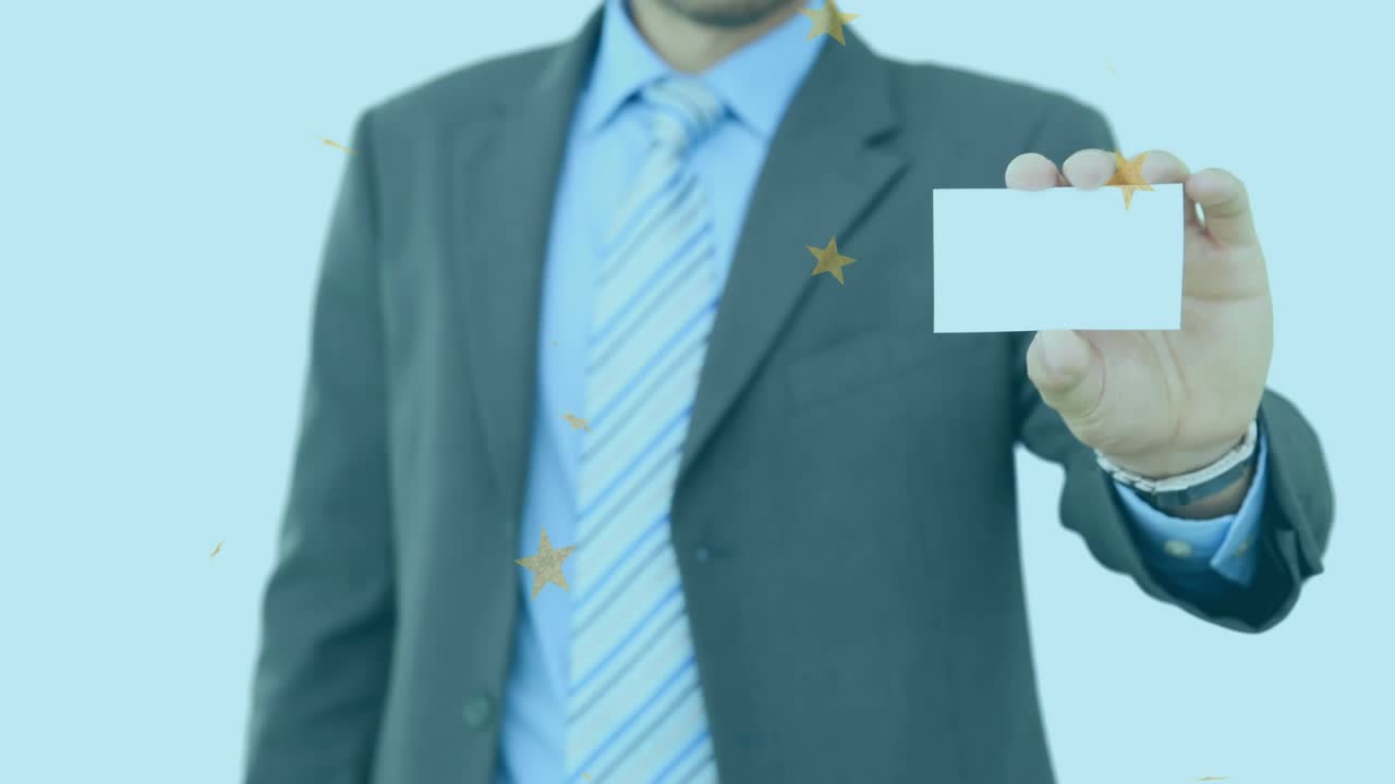 Businessman wearing dark suit raising card upon golden stars swirling and drifting showcasing info