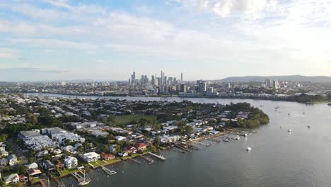 row of jetty at bulimba - brisbane river, suburb and cbd at daytime in queensland, australia