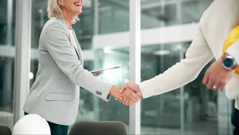 business handshake between architect and engineer