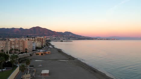 pastel sky over fuengirola hills beach at sunrise