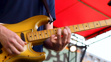 musician playing guitar at a concert