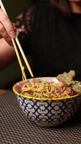 woman eating ramen