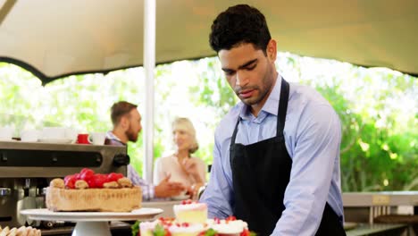 Male-owner-standing-with-arms-crossed