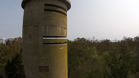 drone shot of world war ii watchtower tracks sideways