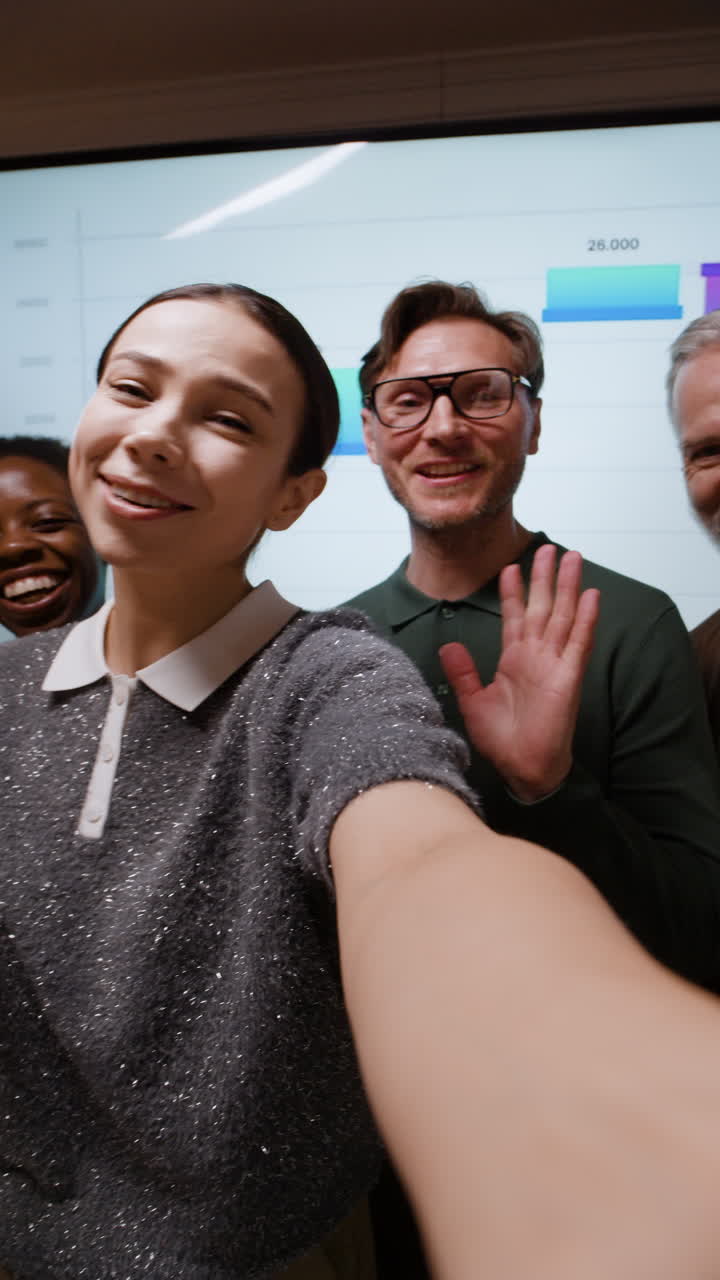 Diverse Business Team Takes a Group Selfie During an Online Meeting