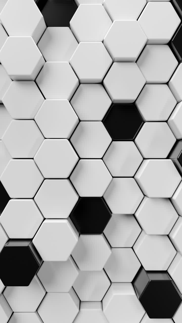 A black and white tiled wall with hexagons. Vertical looped animation