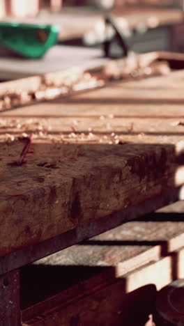 close up of a woodworking bench with wood shavings and tools