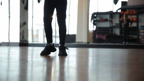 young person practicing dance steps in a studio