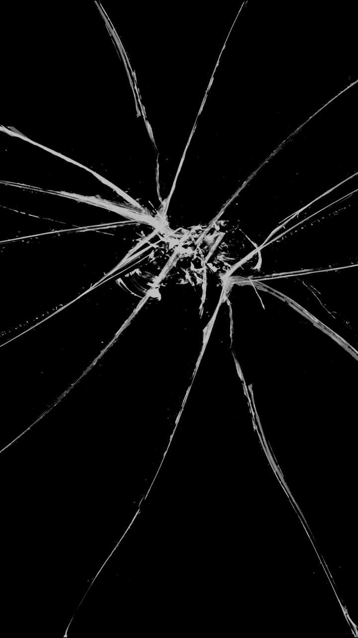 Glass shatters outwards from a central impact point, creating a spiderweb of cracks. A vertical overlay for action scenes, destruction, or impact effects
