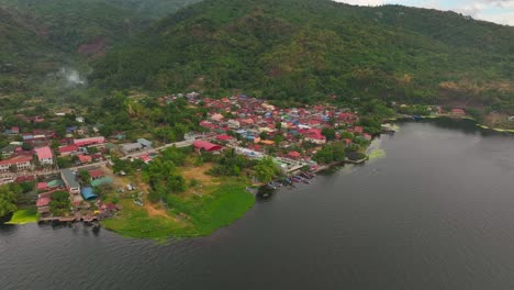 asian village at taal lake in rural landscape at sunset