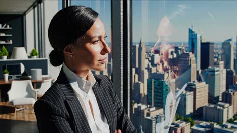 businesswoman looking out at city view