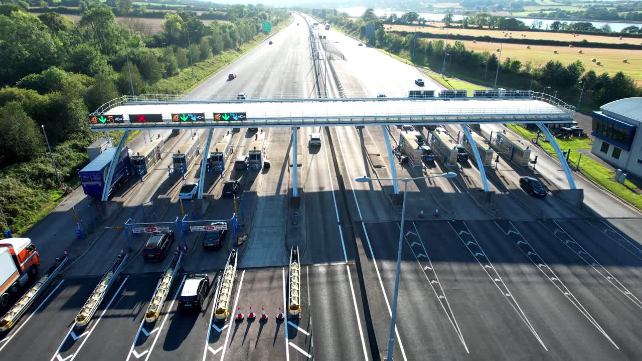 Ireland Epic Locations cars and trucks using Toll booth Waterford City Bypass late on a summer evening