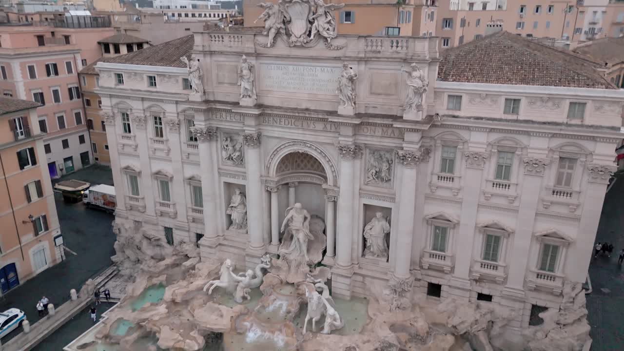 Trevi Fountain in Rome Italy - dramatic tilt down aerial reveal