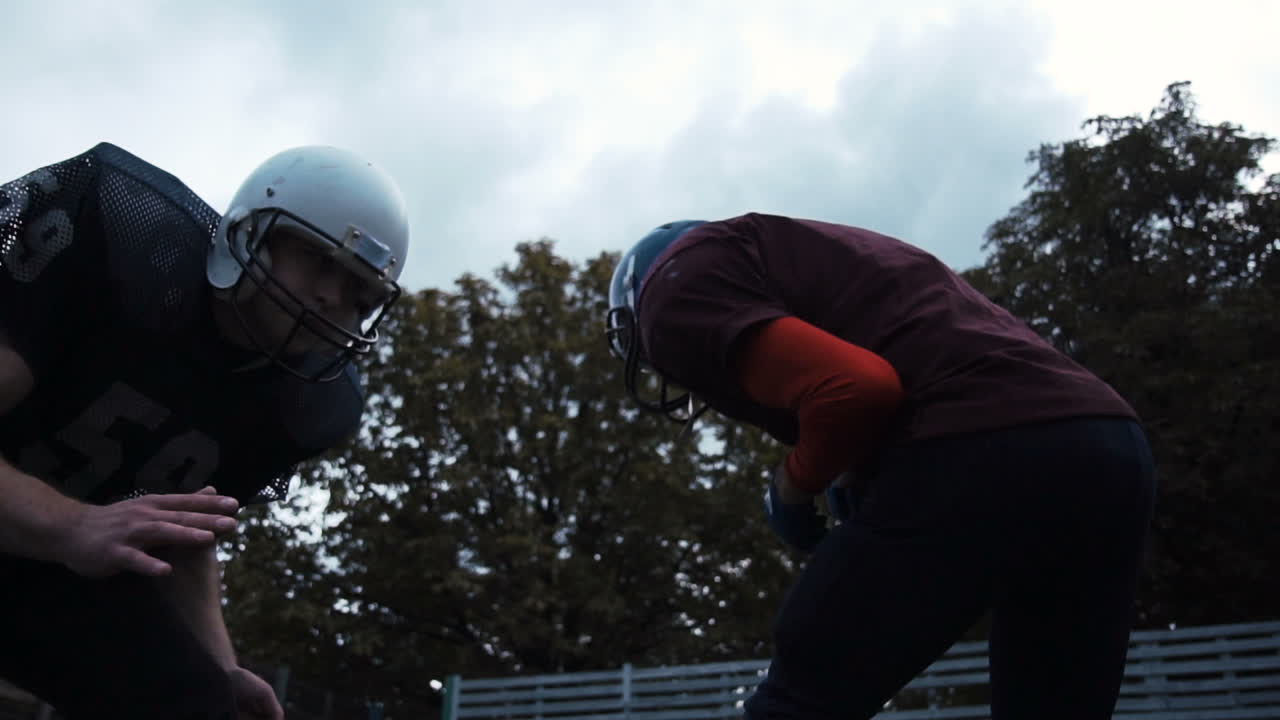 American Football Players Preparing for a Play